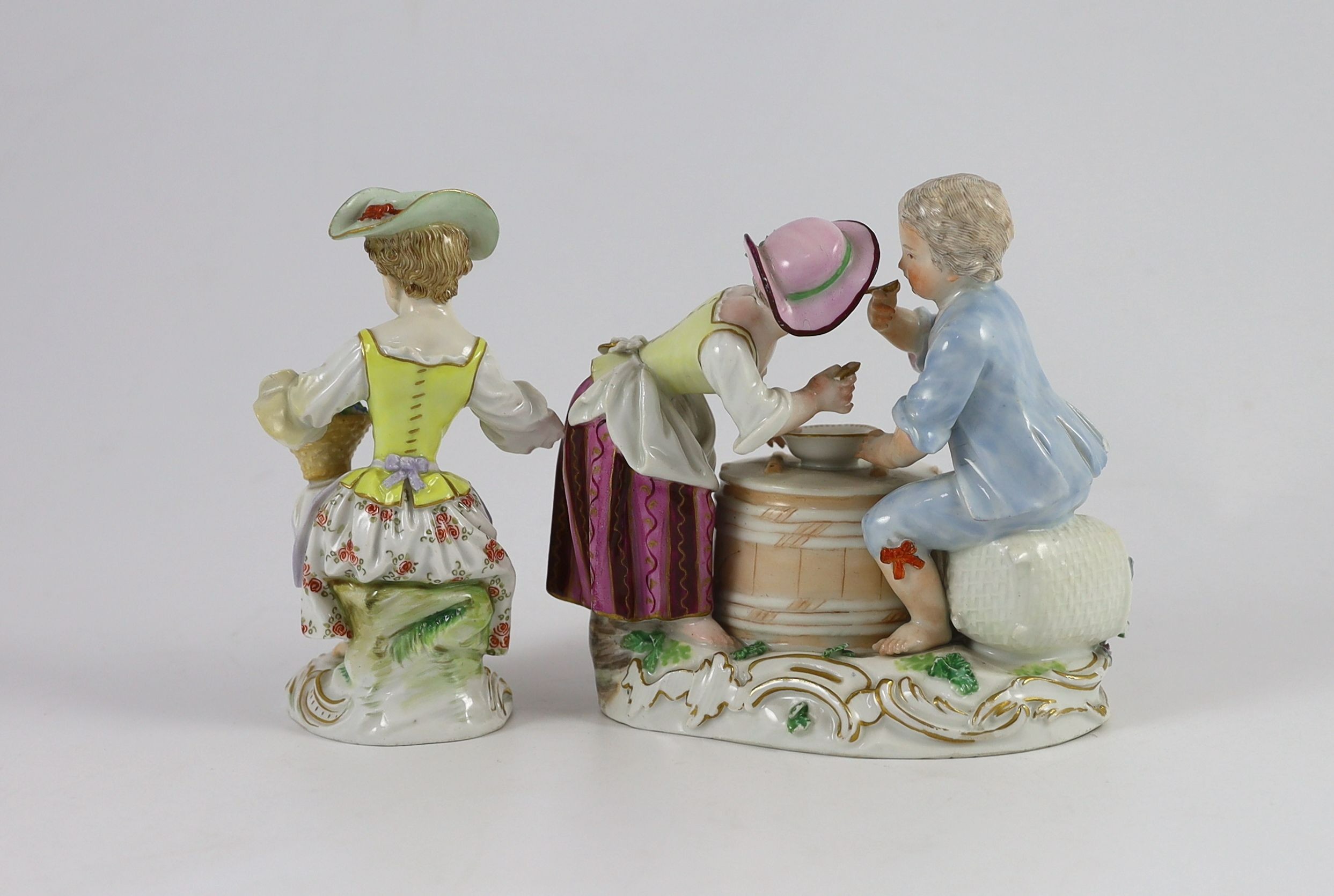 A Meissen group of two children eating from a bowl, dot period and a Meissen figure of a flower girl, early 20th century 12 and 12.5 cm high (2)